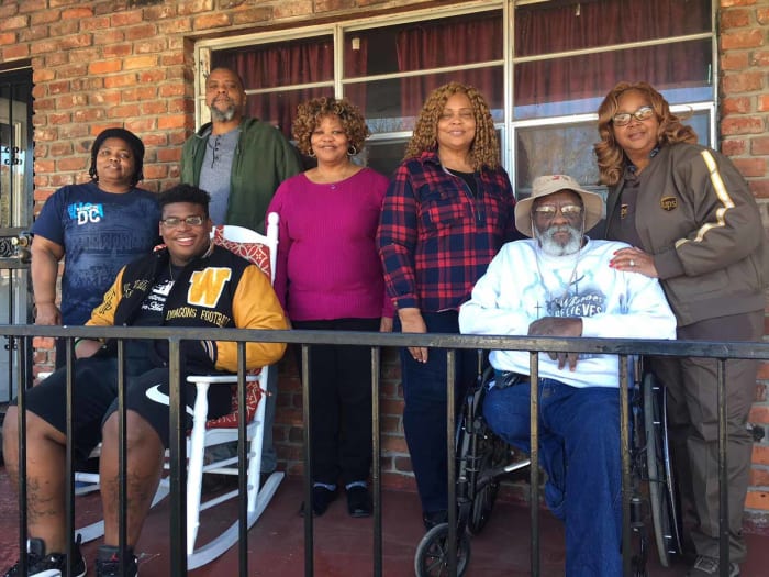 Part of Quinnen Williams's support team is pictured here in a photo taken Wednesday outside of his grandmother's home in Birmingham. From left to right: aunt LaQuita Comack, brother Giovanni Williams, uncle Charles Henderson II, aunt Ivy Allen, grandpa Charles Henderson, grandmother Yvarta Henderson and aunt Marilyn Jackson.
